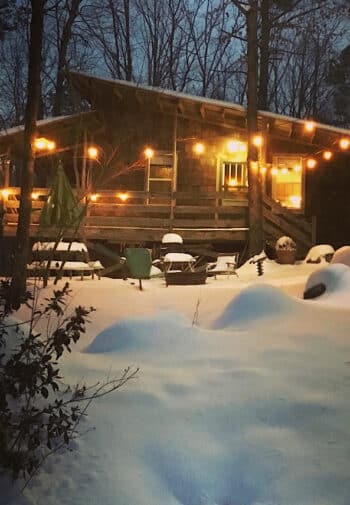 Cabin in the snow in late evening.