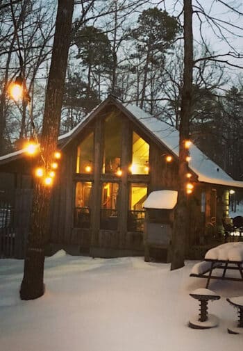 Cabin with loft in early evening snow