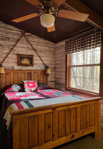 Bedroom with white walls and queen bed